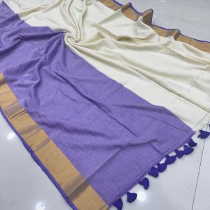 Cream and lavender saree with golden zari border and tassel pallu