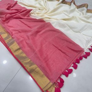 Rani Pink and cream panels with an olive-green border and blue-and-white tassel detailing on the pallu.